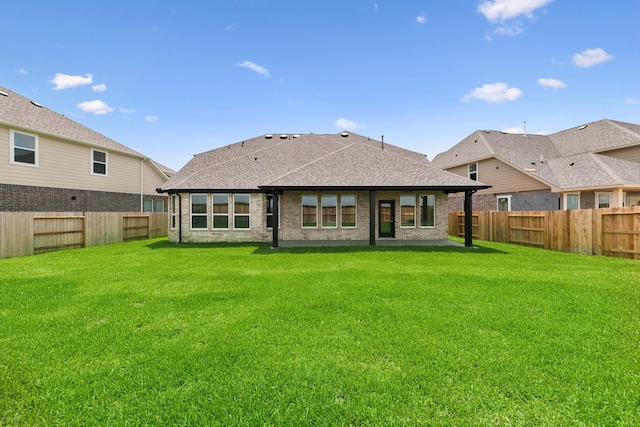8411 Oceanmist Cove Dr, Cypress, TX 77433 - back of house with a fenced backyard and roof with shingles