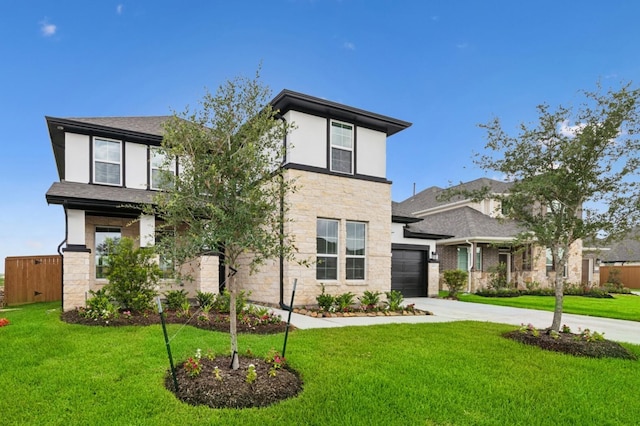 8411 Oceanmist Cove Dr, Cypress, TX 77433 - view of front of house with stone siding, driveway, a front yard, and a garage