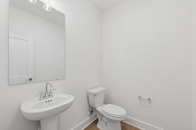 8411 Oceanmist Cove Dr, Cypress, TX 77433 - half bath featuring wood finished floors and toilet