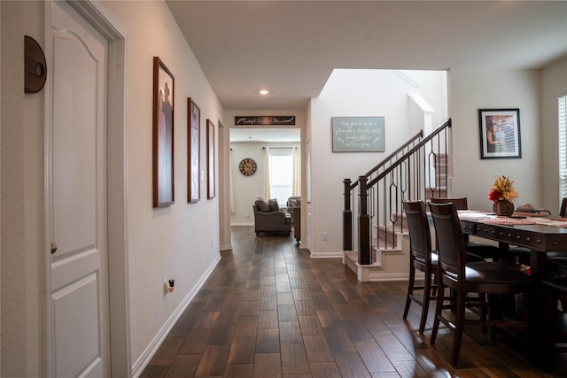 corridor with dark hardwood / wood-style floors