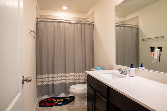 bathroom with vanity, curtained shower, tile patterned floors, and toilet