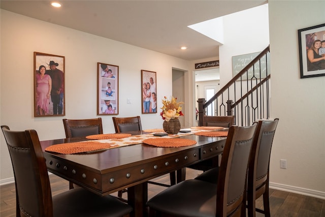 dining space featuring dark hardwood / wood-style floors