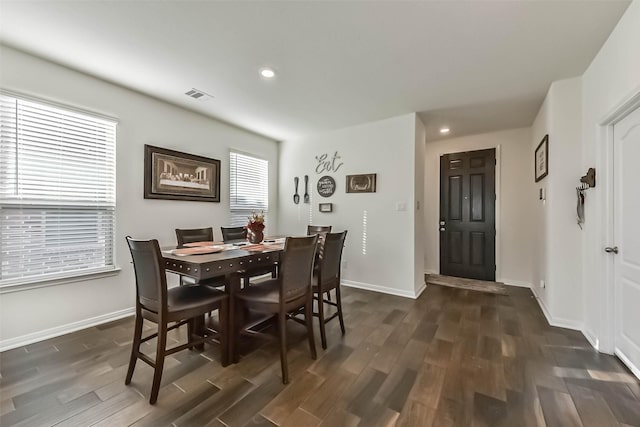 dining area featuring dark wood-style floors, recessed lighting, visible vents, and baseboards