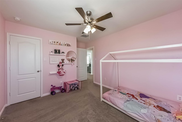 unfurnished bedroom featuring carpet, baseboards, and ceiling fan