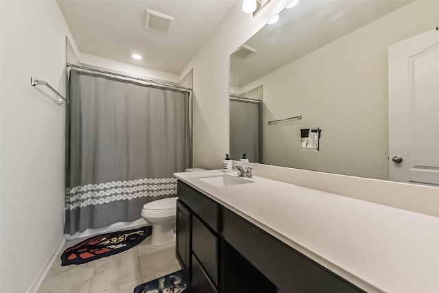 full bathroom with visible vents, vanity, toilet, and tile patterned floors