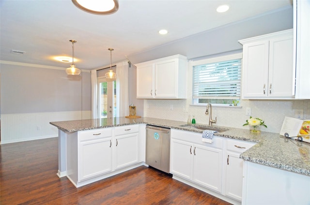 kitchen with white cabinets, decorative light fixtures, a peninsula, stainless steel dishwasher, and a sink