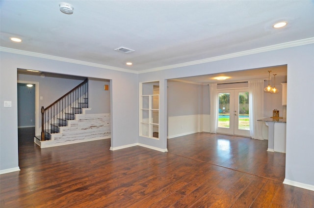 spare room with dark wood-style floors, french doors, stairway, and ornamental molding