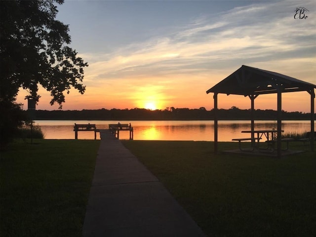 dock area featuring a gazebo and a water view