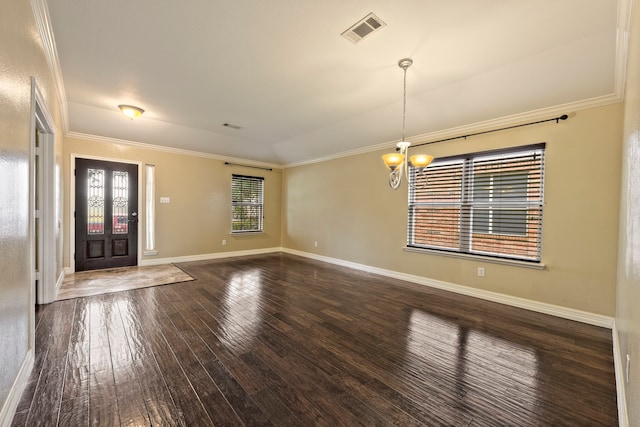 interior space with dark hardwood / wood-style flooring, a notable chandelier, crown molding, and lofted ceiling