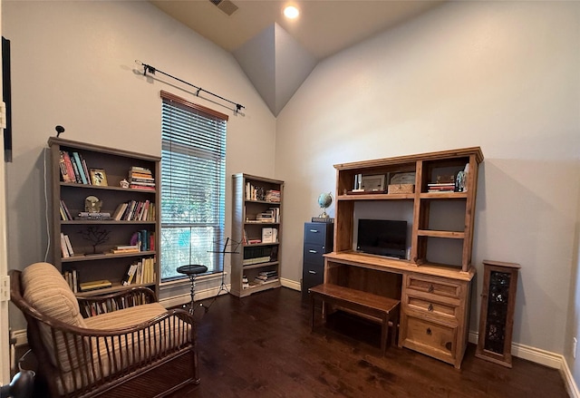 sitting room with vaulted ceiling and dark wood-type flooring