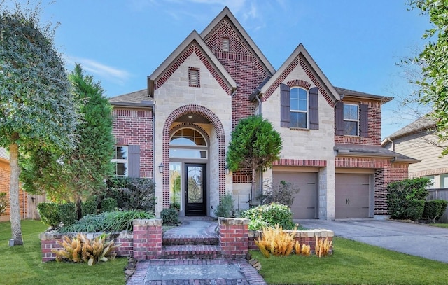 view of front of house featuring a garage and a front lawn