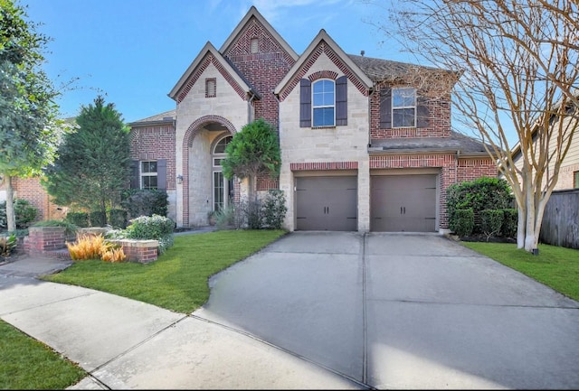 view of front of house featuring a garage and a front yard