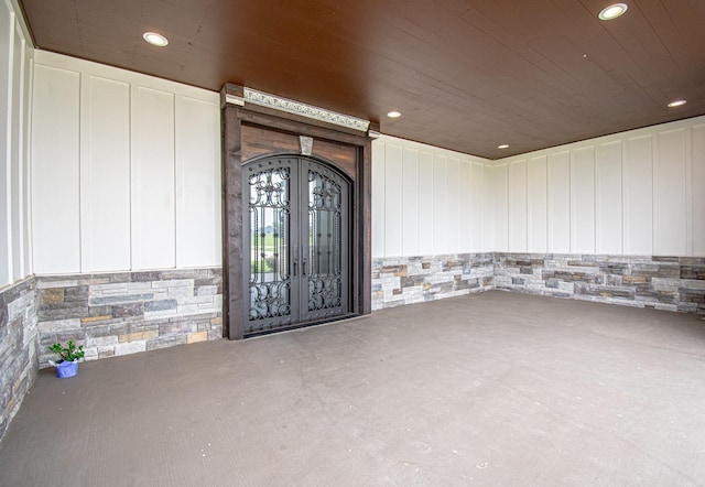 view of exterior entry featuring french doors