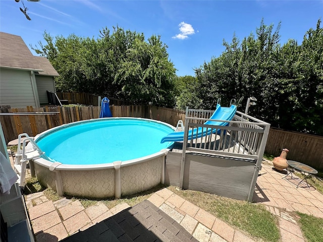 view of swimming pool with a patio