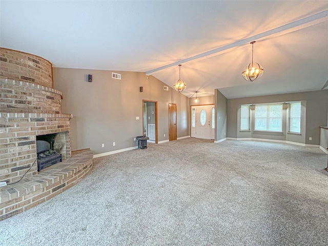 unfurnished living room with a chandelier, vaulted ceiling with beams, a fireplace, visible vents, and baseboards