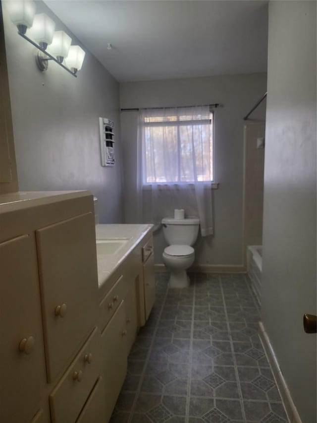 full bathroom with bathtub / shower combination, tile patterned floors, vanity, and toilet