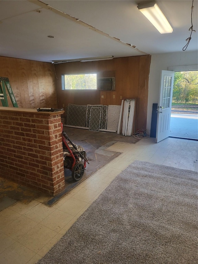 basement featuring wood walls