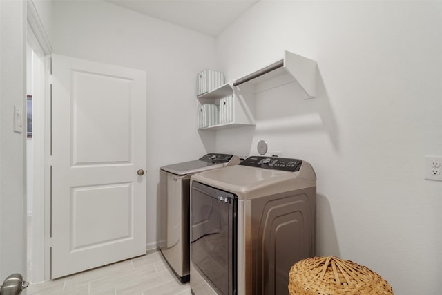 laundry area with independent washer and dryer