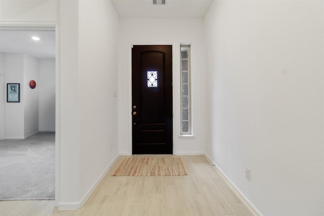 entryway with light hardwood / wood-style flooring