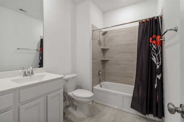 full bathroom featuring toilet, vanity, and shower / bathtub combination with curtain