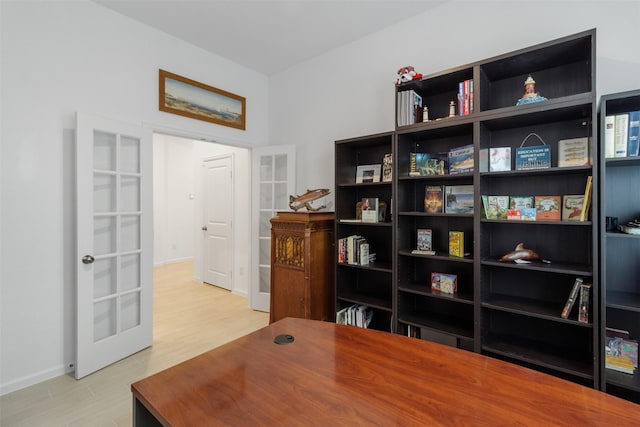 office area featuring french doors and light hardwood / wood-style flooring