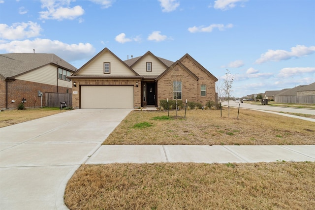 view of front of home featuring a garage and a front yard