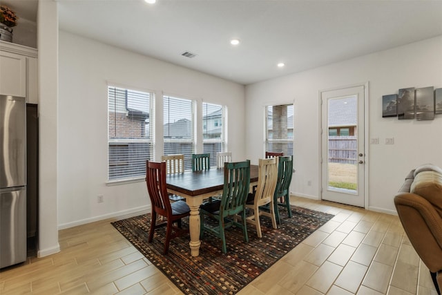 dining room with light hardwood / wood-style flooring