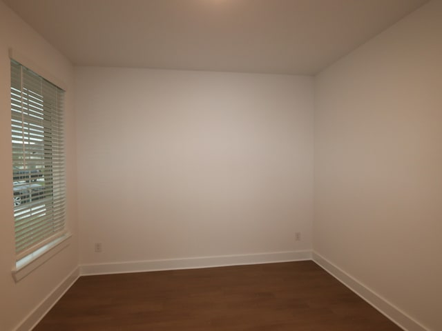 8515 Pier Cove Dr, Cypress, TX 77433 - empty room featuring dark wood-style floors