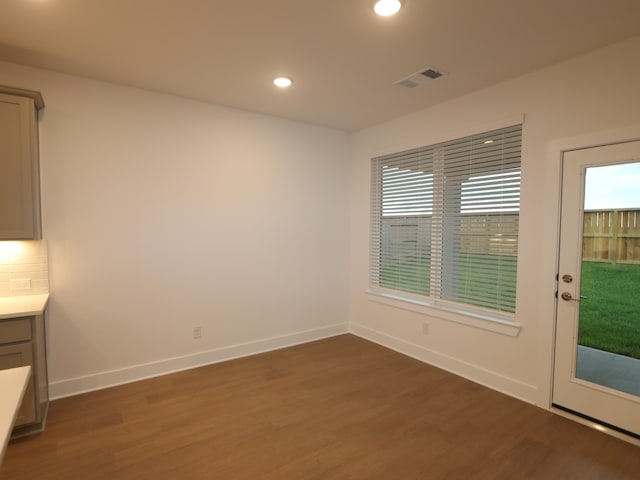 8515 Pier Cove Dr, Cypress, TX 77433 - unfurnished dining area featuring wood finished floors and recessed lighting