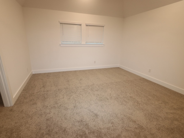 8515 Pier Cove Dr, Cypress, TX 77433 - carpeted spare room with baseboards