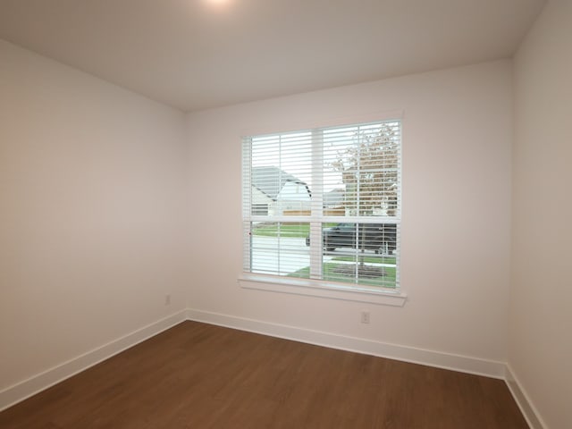 8515 Pier Cove Dr, Cypress, TX 77433 - empty room featuring baseboards and dark wood-style flooring