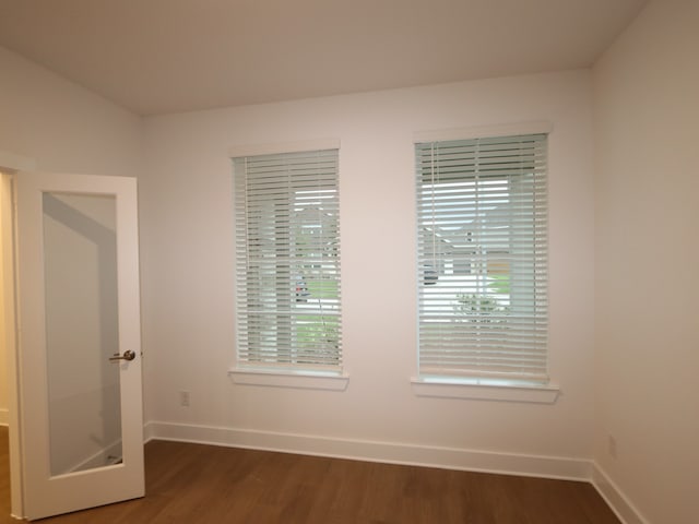 8515 Pier Cove Dr, Cypress, TX 77433 - unfurnished room featuring dark wood-style floors and baseboards