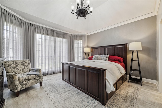 bedroom featuring multiple windows, crown molding, and a chandelier