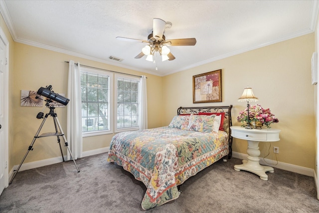 bedroom with ornamental molding, ceiling fan, and carpet flooring