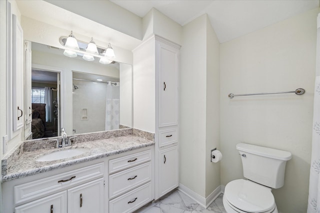 bathroom featuring walk in shower, vanity, and toilet