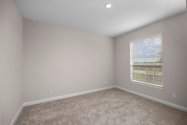 empty room featuring light colored carpet