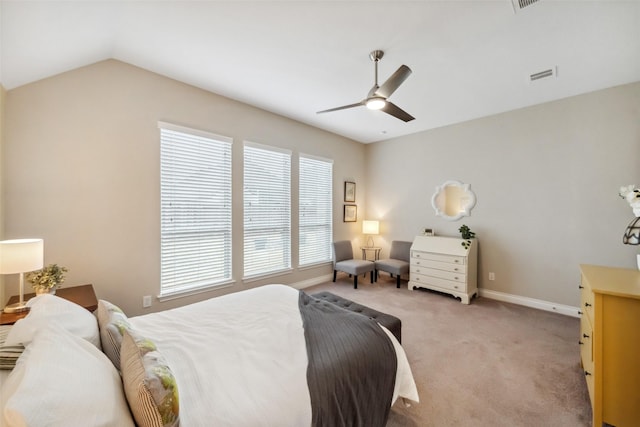 bedroom featuring light carpet, lofted ceiling, and ceiling fan