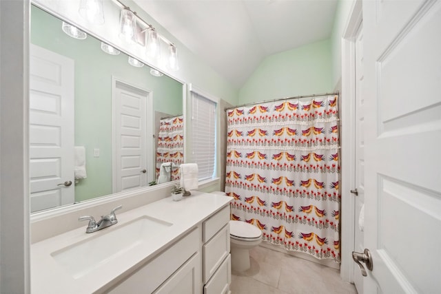 bathroom with vaulted ceiling, curtained shower, vanity, toilet, and tile patterned floors