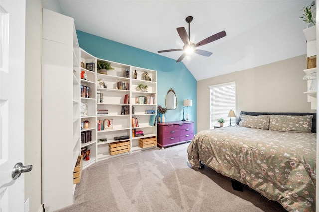 carpeted bedroom featuring lofted ceiling and ceiling fan