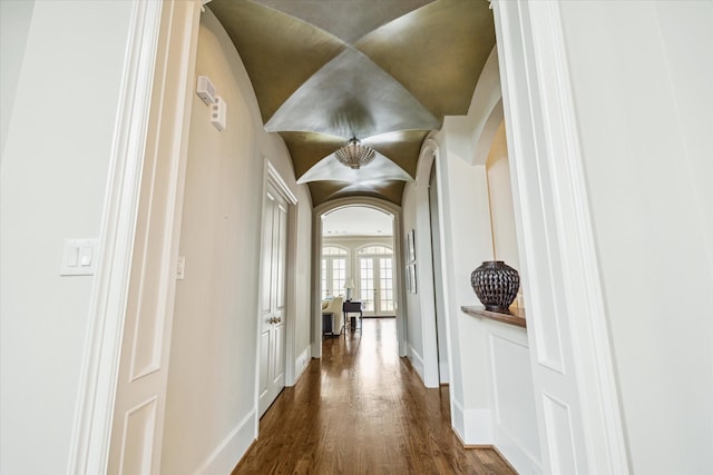 corridor featuring dark wood-type flooring