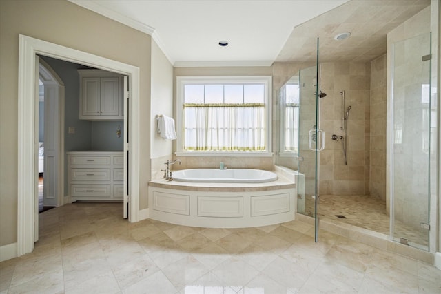 bathroom with independent shower and bath and crown molding