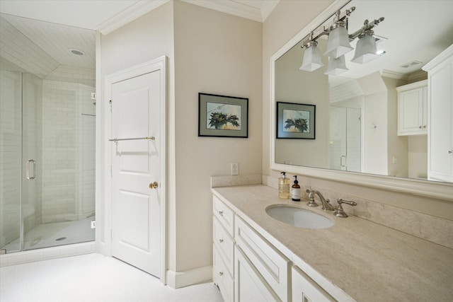 bathroom featuring ornamental molding, a shower with shower door, and vanity