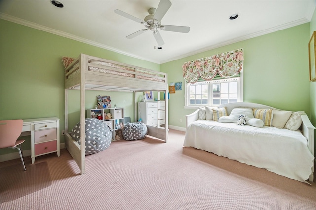 bedroom with ceiling fan, ornamental molding, and carpet floors