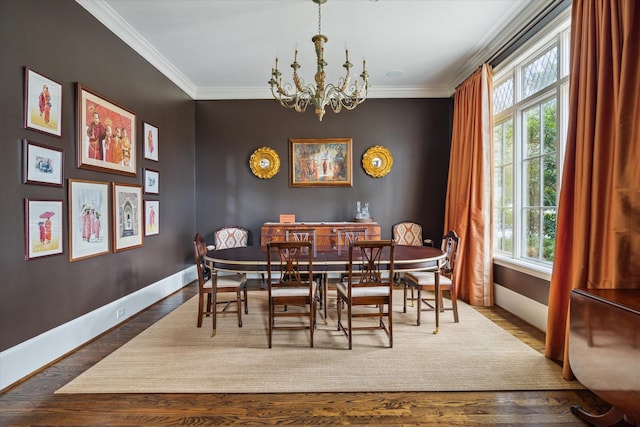 dining room featuring a notable chandelier, wood-type flooring, and ornamental molding