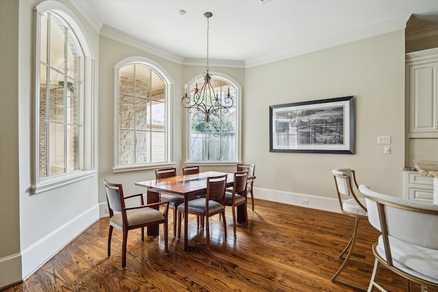 dining space featuring crown molding, dark hardwood / wood-style floors, and an inviting chandelier