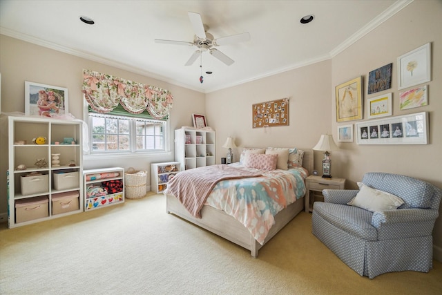 carpeted bedroom featuring crown molding and ceiling fan