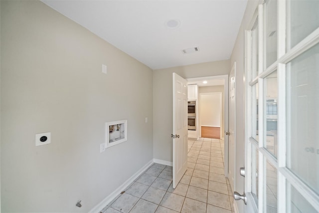 laundry area with hookup for a washing machine, electric dryer hookup, and light tile patterned floors