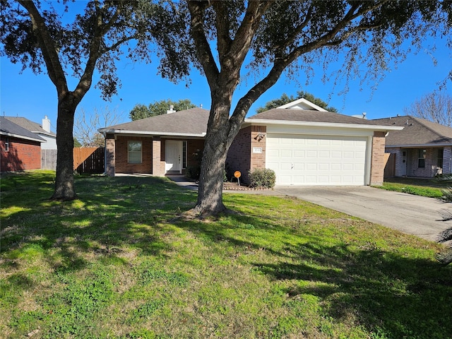 single story home with a garage and a front lawn