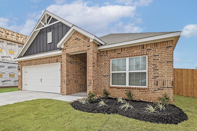 view of front of home featuring a garage and a front lawn