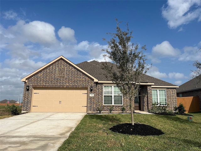 view of front of property featuring a garage and a front yard